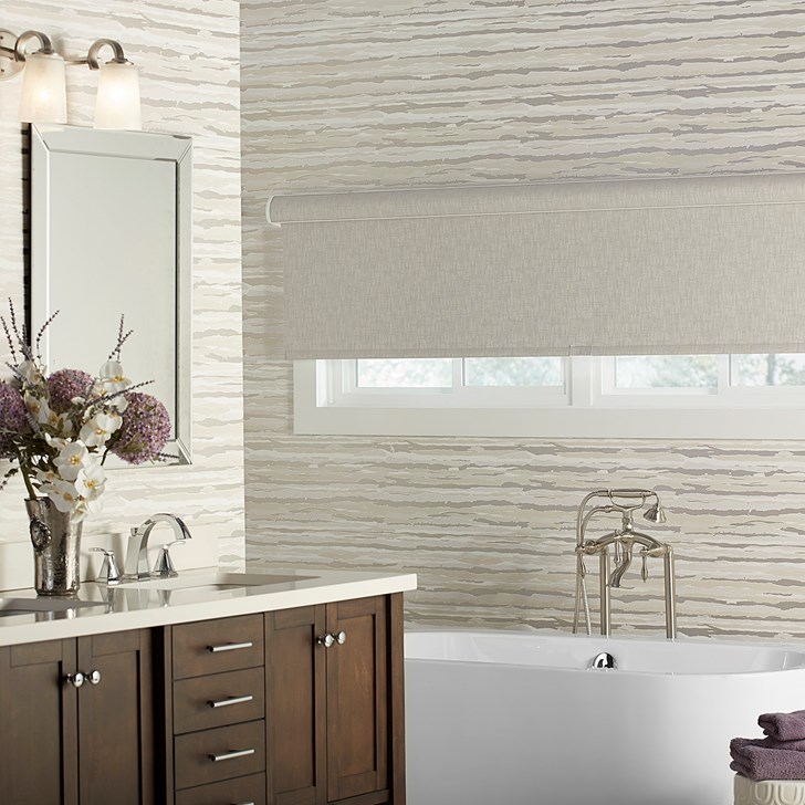 Outside mounted blackout roller shade. Color: Lakeshore Blackout Haze 11605