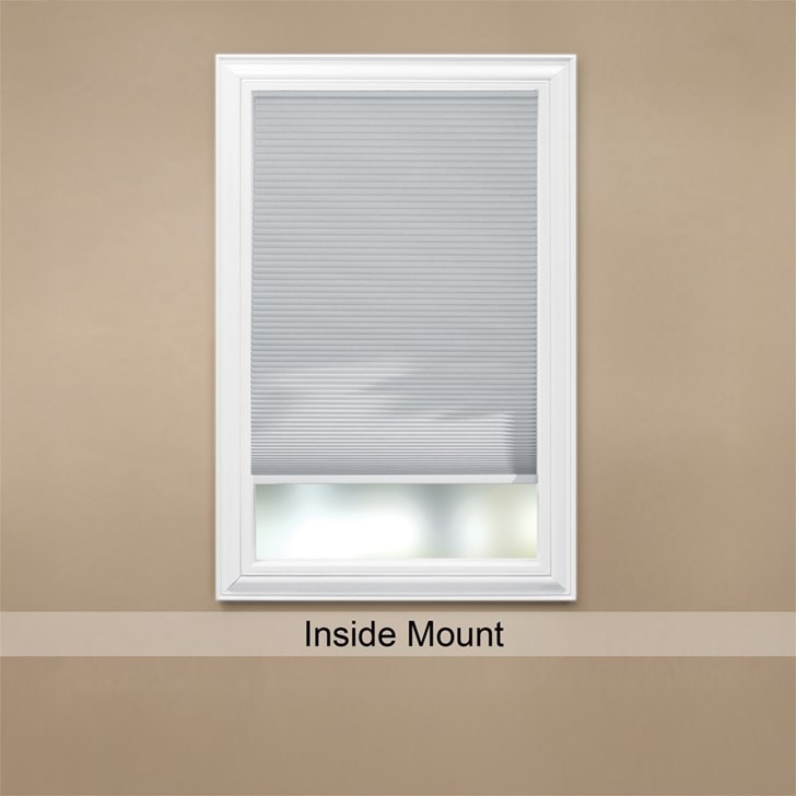 Inside mount blackout cellular shade shown in Shadow White